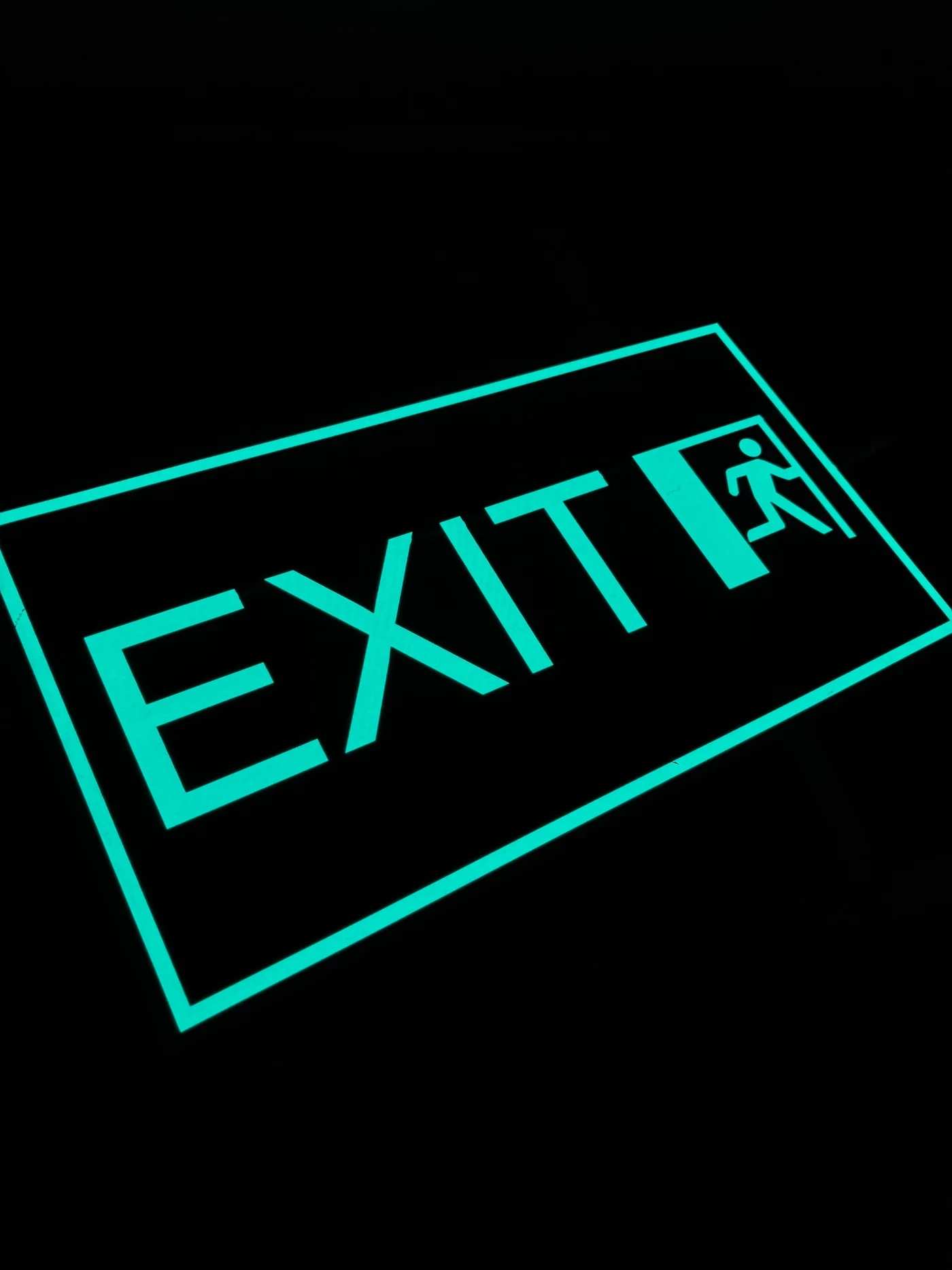 A glowing EL exit sign